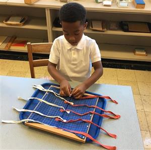 Student using Montessori material